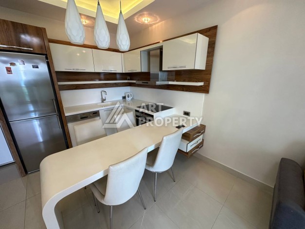 Квартира 1+1 с прямым видом на море в районе Махмутлар - Ракурс 9