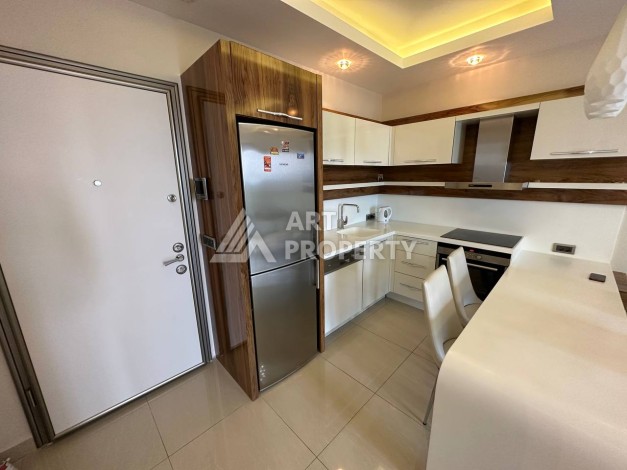 Квартира 1+1 с прямым видом на море в районе Махмутлар - Ракурс 11