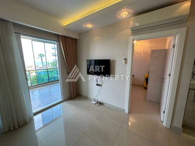 Квартира 1+1 с прямым видом на море в районе Махмутлар - Ракурс 12