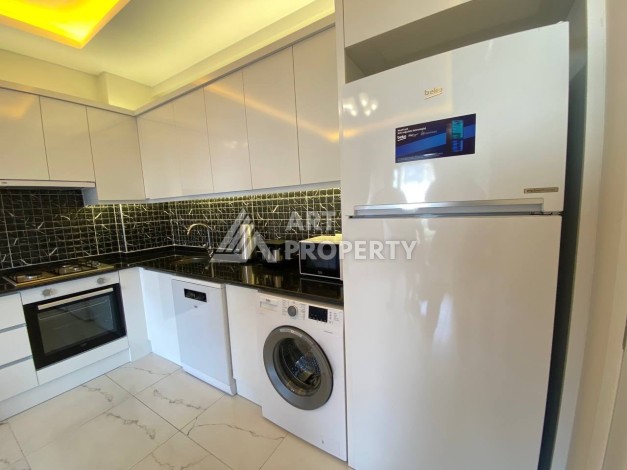 Квартира 1+1 в новом комплексе в районе Махмутлар возле моря - Ракурс 12