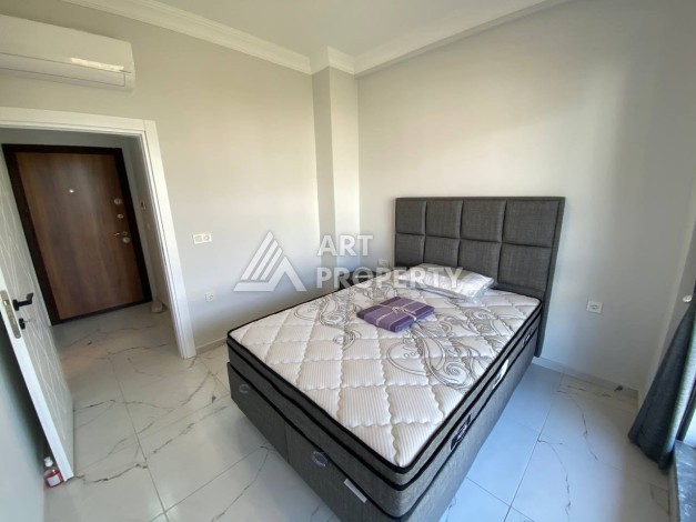 Квартира 1+1 в новом комплексе в районе Махмутлар возле моря - Ракурс 18