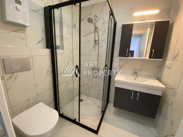 Квартира 1+1 в новом комплексе в районе Махмутлар возле моря - Ракурс 19