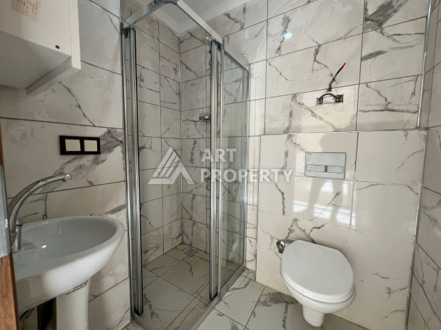 Двухкомнатная картира 48 кв.м. по горячей цене. Махмутлар, Алания. - Ракурс 16