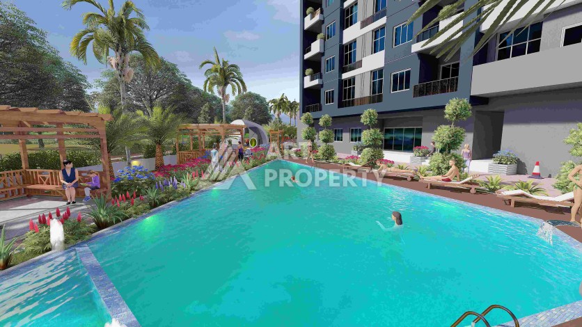 Квартиры 2+1 и 3+1 в строящейся резиденции у моря в Мерсине, от 79,5 кв.м. - Ракурс 6