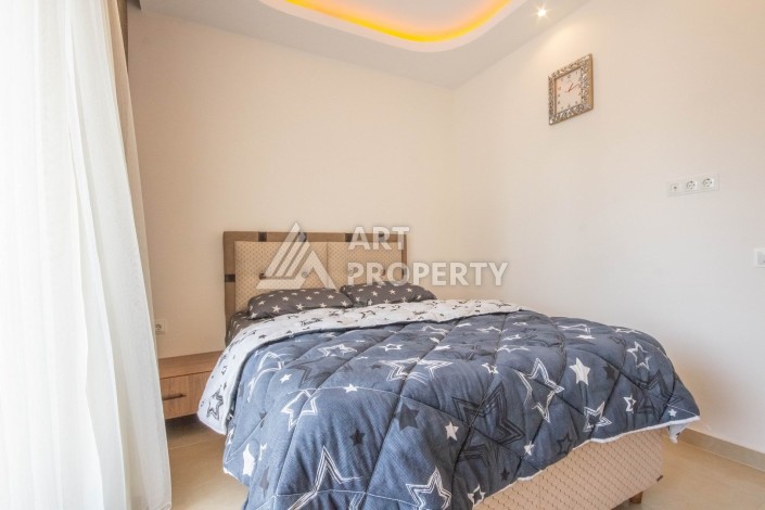 Квартира 1+1 с видом на море в элитном комплексе, 50 кв.м. Махмутлар, Алания. - Ракурс 11