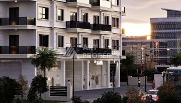 Престижная резиденция высокого качества в 150 метрах от моря в центре Махмутлара, квартиры от 55 кв.м. - Ракурс 2
