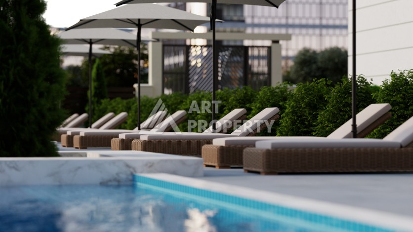 Престижная резиденция высокого качества в 150 метрах от моря в центре Махмутлара, квартиры от 55 кв.м. - Ракурс 2