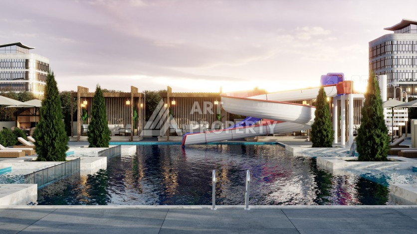 Престижная резиденция высокого качества в 150 метрах от моря в центре Махмутлара, квартиры от 55 кв.м. - Ракурс 8