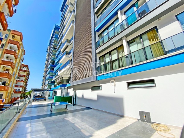 Квартира 1+1 с видом на море на первой береговой линии в Махмутларе, 61 кв.м. - Ракурс 2