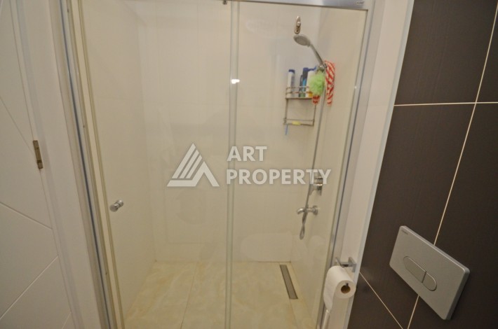 Квартира 1+1 с видом на море на первой береговой линии в Махмутларе, 61 кв.м. - Ракурс 21