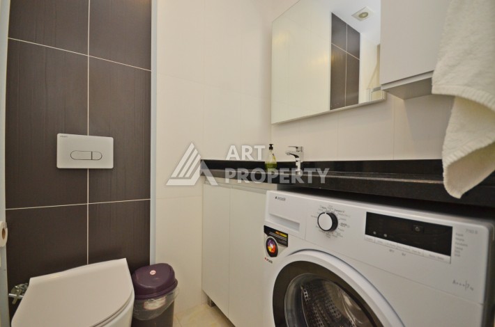 Квартира 1+1 с видом на море на первой береговой линии в Махмутларе, 61 кв.м. - Ракурс 22