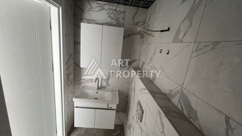 Квартира 1+1 в новом ЖК, 50 кв.м. Махмутлар, Алания. - Ракурс 10