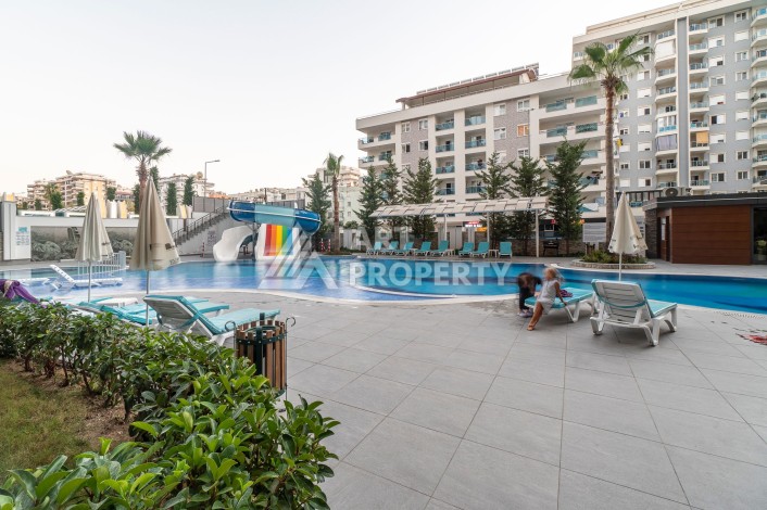 Квартира 2+1 в престижном комплексе, 95 кв.м. Махмутлар, Алания. - Ракурс 2