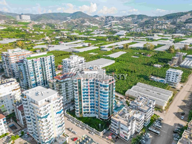 Квартира 1+1 в престижном ЖК в 450 м. от моря в Махмутларе, 65 кв.м. - Ракурс 2