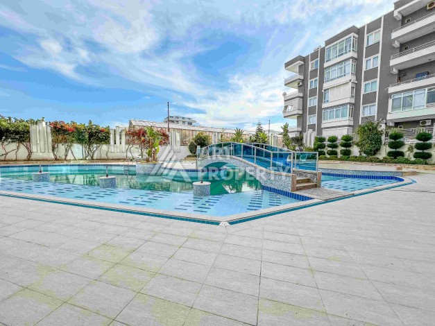 Квартира 1+1 в престижном ЖК в 450 м. от моря в Махмутларе, 65 кв.м. - Ракурс 9