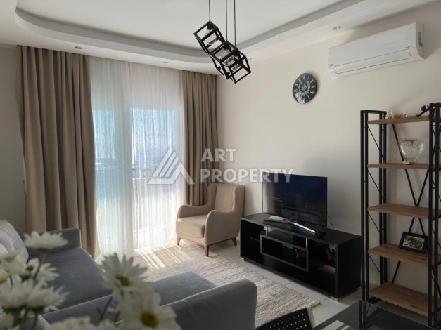 Квартира 1+1 в престижном ЖК в 450 м. от моря в Махмутларе, 65 кв.м. - Ракурс 10