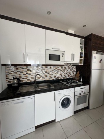 Квартира 1+1 в престижном ЖК в 450 м. от моря в Махмутларе, 65 кв.м. - Ракурс 15