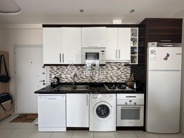 Квартира 1+1 в престижном ЖК в 450 м. от моря в Махмутларе, 65 кв.м. - Ракурс 16