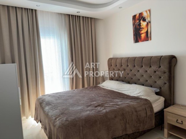 Квартира 1+1 в престижном ЖК в 450 м. от моря в Махмутларе, 65 кв.м. - Ракурс 17