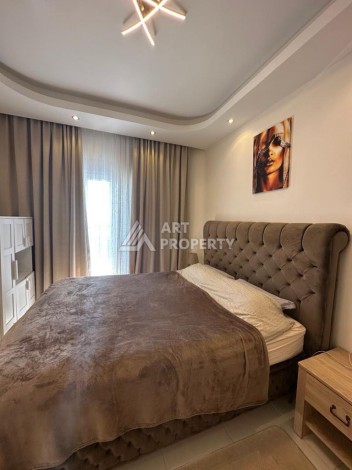 Квартира 1+1 в престижном ЖК в 450 м. от моря в Махмутларе, 65 кв.м. - Ракурс 18