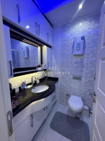 Квартира 1+1 в престижном ЖК в 450 м. от моря в Махмутларе, 65 кв.м. - Ракурс 20