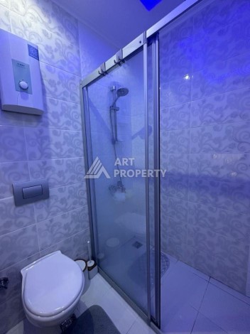 Квартира 1+1 в престижном ЖК в 450 м. от моря в Махмутларе, 65 кв.м. - Ракурс 21