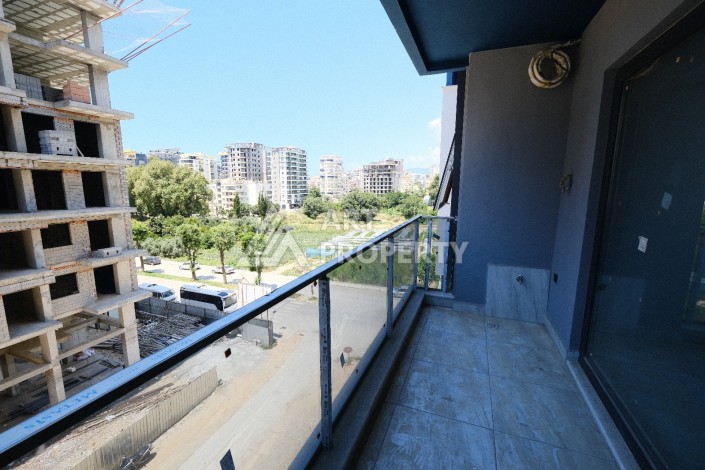 Квартира 1+1  с площадью 60 кв.м всего в 300 метрах в популярном районе Махмутлар - Ракурс 19