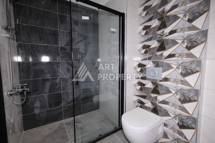 Квартира 1+1  с площадью 60 кв.м всего в 300 метрах в популярном районе Махмутлар - Ракурс 22