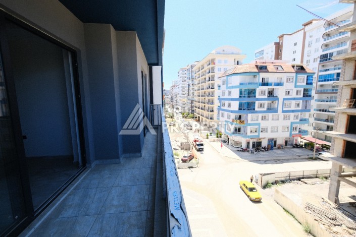 Квартира 1+1  с площадью 60 кв.м всего в 300 метрах в популярном районе Махмутлар - Ракурс 23