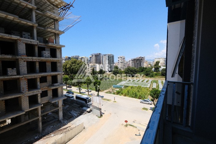 Квартира 1+1  с площадью 60 кв.м всего в 300 метрах в популярном районе Махмутлар - Ракурс 24