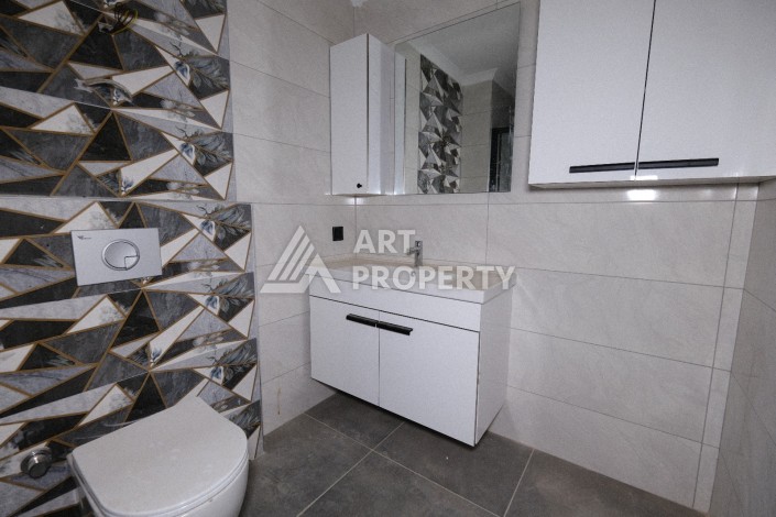 Квартира 1+1  с площадью 60 кв.м всего в 300 метрах в популярном районе Махмутлар - Ракурс 26