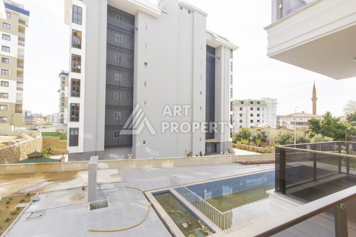 Бюджетная квартира 1+1 в новом комплексе, 60 кв.м. в Авсалларе. - Ракурс 2