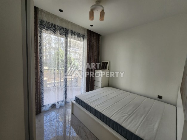 Квартира 1+1 в элитном комплексе, 56 кв.м. Оба, Алания - Ракурс 16