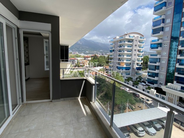 Квартира 1+1 с видом на горы в Махмутларе, 55 кв.м. - Ракурс 9