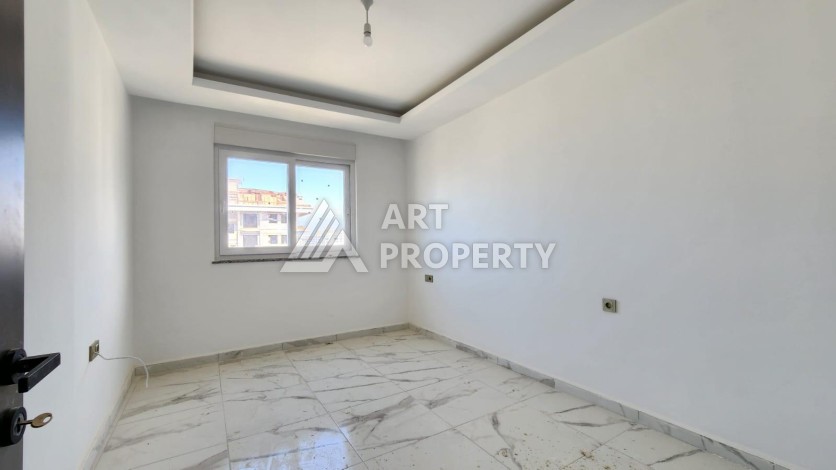 Квартира 2+1 с видом на море и крепость, 72 м2 в Махмутларе - Ракурс 23