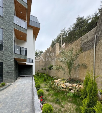 Квартиры от 45 до 193 кв.м. с видом на море и крепость. Буюкхасбахче, Алания - Ракурс 12