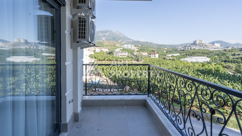 Квартира 1+1 с приятным видом на горы в Махмутларе, 55 кв.м. - Ракурс 3