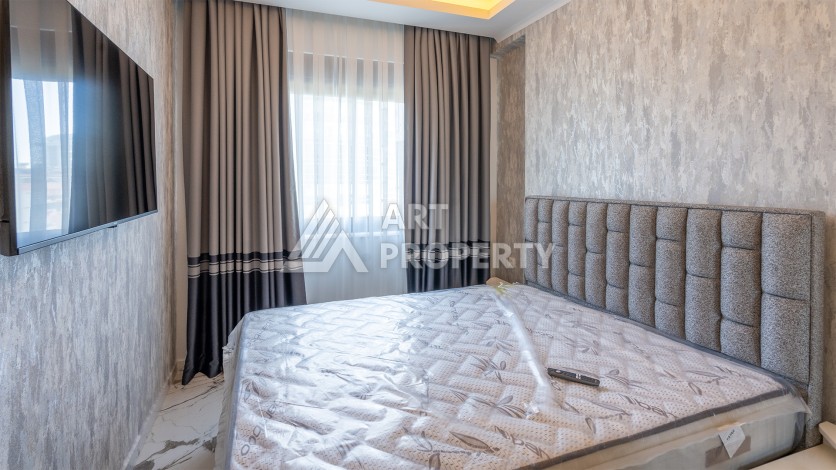 Квартира 1+1 с приятным видом на горы в Махмутларе, 55 кв.м. - Ракурс 4