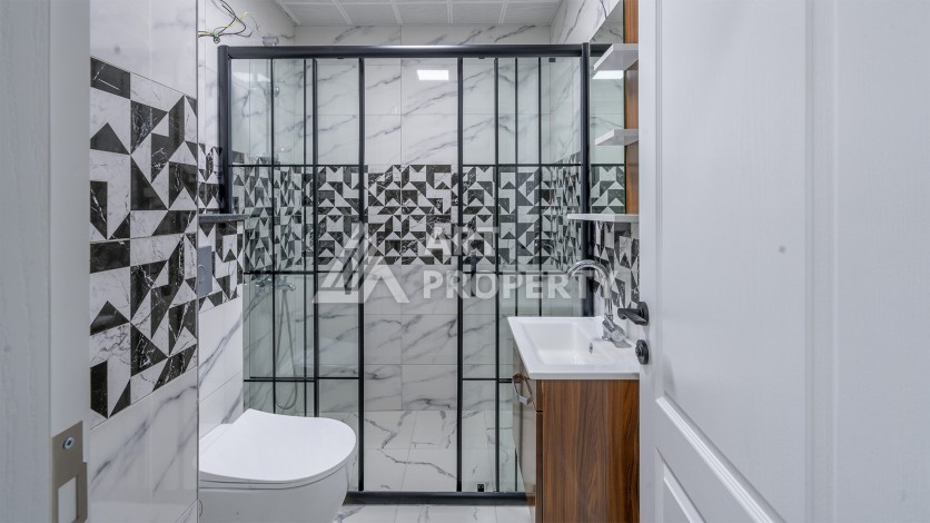 Квартира 1+1 с приятным видом на горы в Махмутларе, 55 кв.м. - Ракурс 5