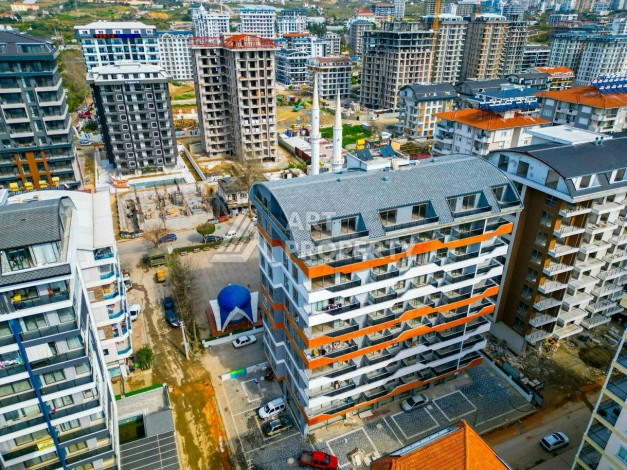 Квартира 1+1 в центре Махмутлара, 55 кв.м. - Ракурс 2