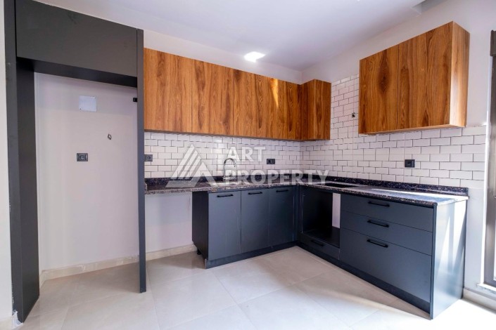 Квартира 1+1 в центре Махмутлара, 55 кв.м. - Ракурс 3