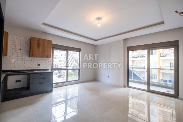 Квартира 1+1 в центре Махмутлара, 55 кв.м. - Ракурс 4