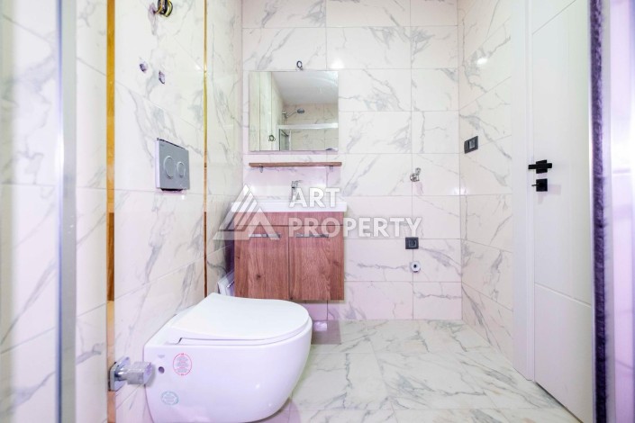 Квартира 1+1 в центре Махмутлара, 55 кв.м. - Ракурс 9