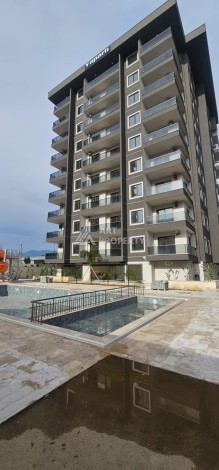 Квартира 1+1 в новой элитной резиденции, 62 кв.м. Махмутлар, Алания. - Ракурс 31