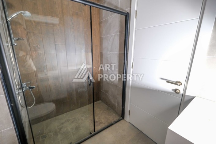 Квартира 1+1 в новом комплексе в Махмутларе, 60 кв.м. - Ракурс 11