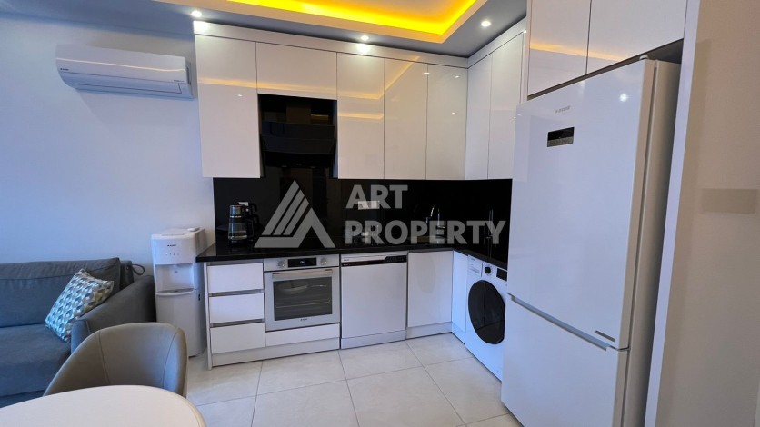 Меблированная квартира 1+1 в престижной резиденции, 55 кв.м. в Махмутларе - Ракурс 6