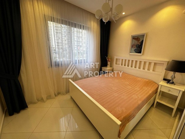 Квартира 1+1 в резиденции отельного типа в Махмутларе, 55 кв.м. - Ракурс 10