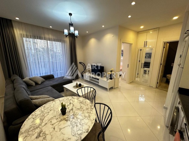 Квартира 1+1 в резиденции отельного типа в Махмутларе, 55 кв.м. - Ракурс 17