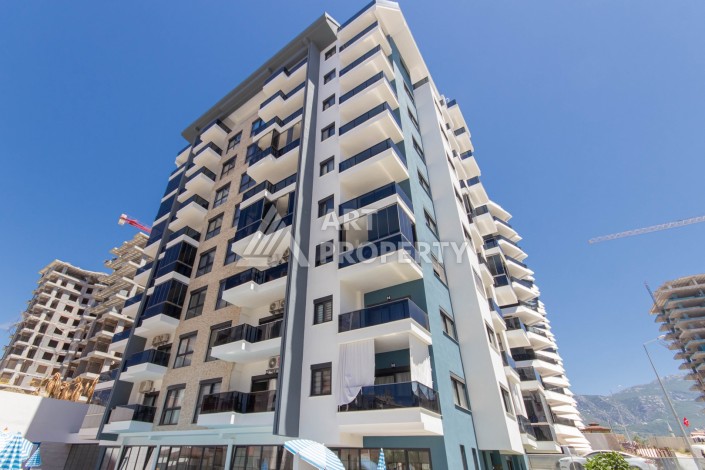 Просторная квартира 1+1 в современном комплексе, 67 кв.м. в Махмутларе. - Ракурс 4