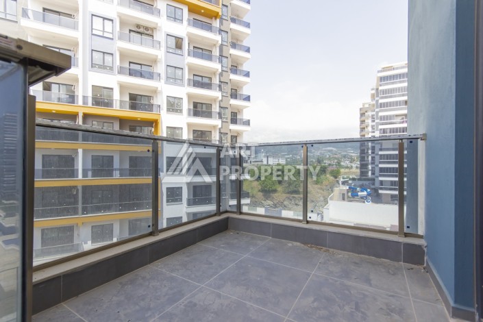 Просторная квартира 1+1 в современном комплексе, 67 кв.м. в Махмутларе. - Ракурс 19